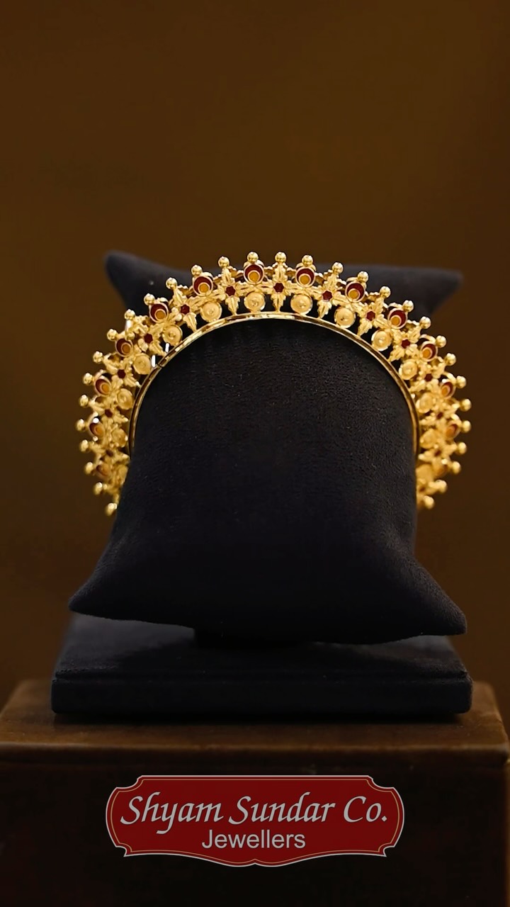 Gold Kankan
A beautifully crafted gold Kankan featuring intricate floral motifs,